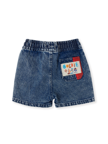 The Goldie + Ace Primary Pop Noah Denim Shorts in Dark Denim pictured on a transparent background. The material is 100% cotton. It is a bottom made for babies, toddlers and kids.