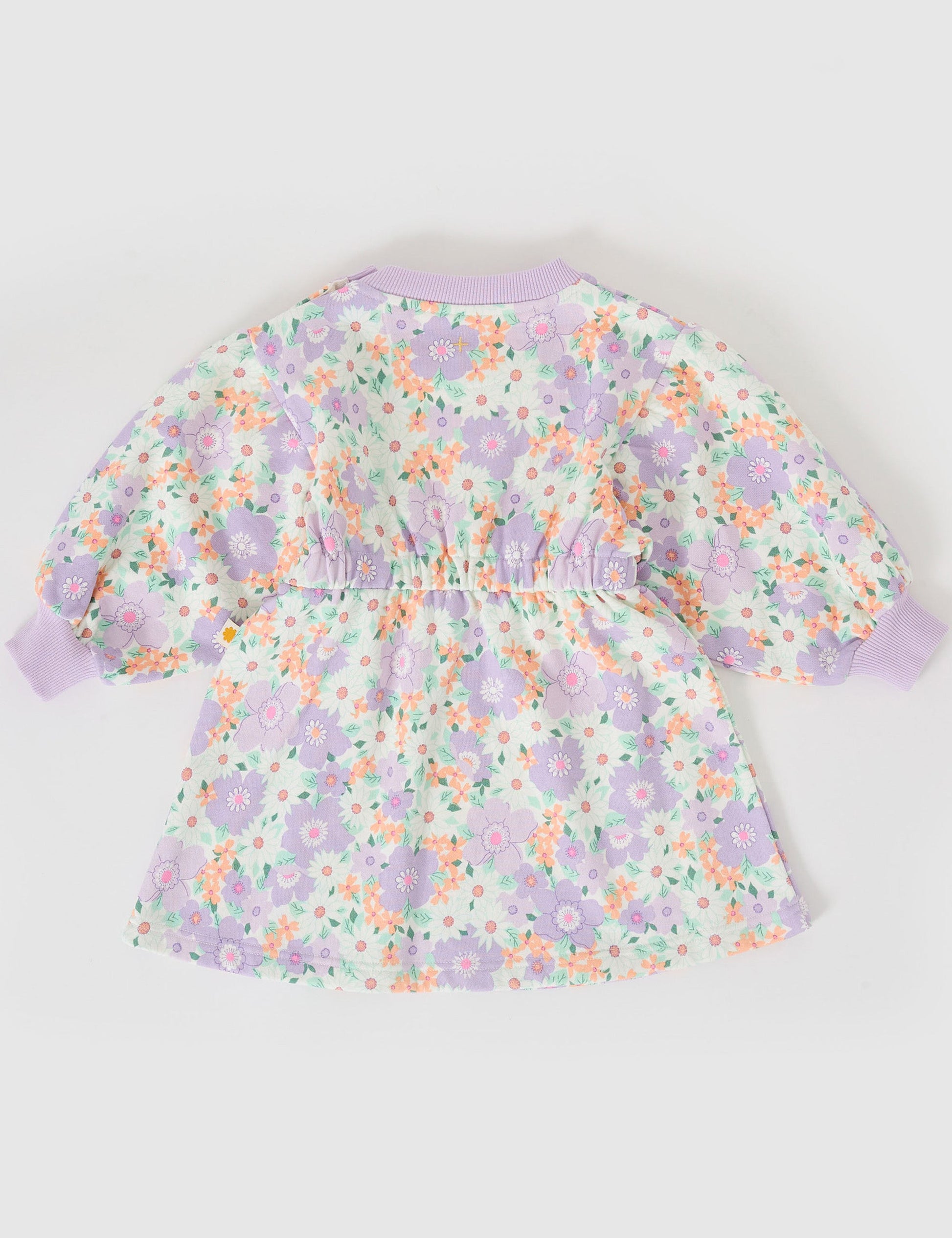 The Goldie + Ace Flora Leah Long Sleeve Dress in Lilac Multi pictured on a grey background. The material is cotton terry. It is a dress made for babies, toddlers and kids.