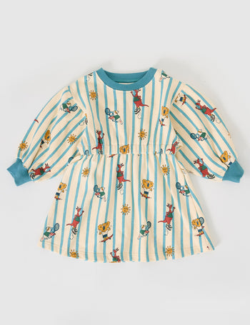 The Goldie + Ace Goldie Squad Leah Long Sleeve Dress in Vanilla/Dusty Blue pictured on a grey background. The material is cotton terry. It is a dress made for babies, toddlers and kids.