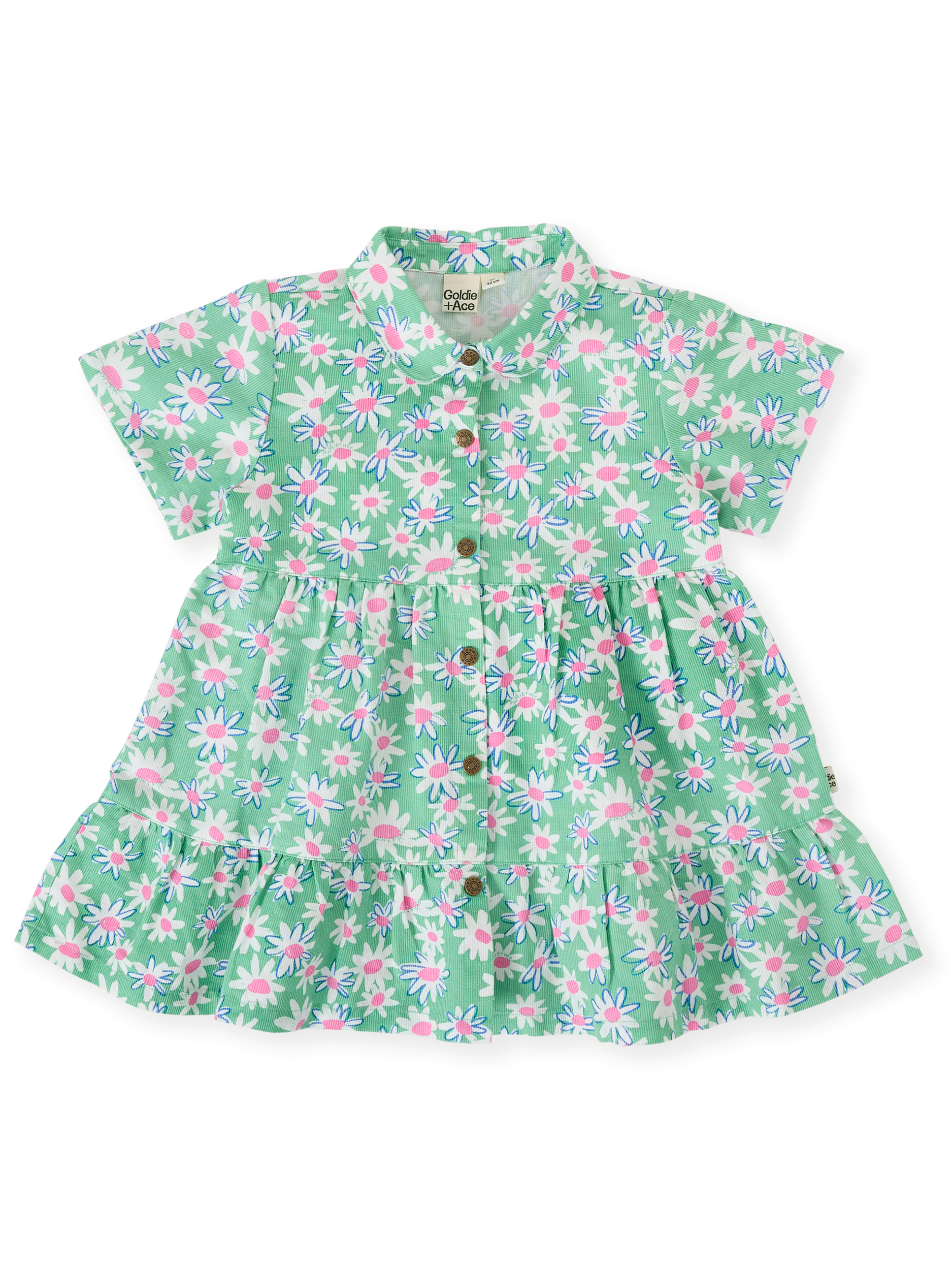 The Goldie + Ace Daisy Patch Monica Dress in Moss pictured on a transparent background. The material is breathable cotton-linen blend. It is a dress made for babies, toddlers and kids.