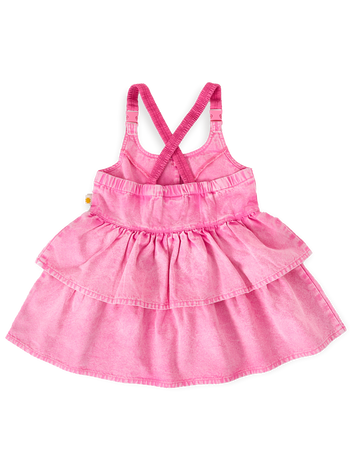 The Goldie + Ace Saskia Denim Frill Pinafore Dress in Pink Lemonade pictured on a transparent background. The material is cotton. It is a dress made for babies, toddlers and kids.