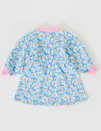 The Goldie + Ace Leah Long Sleeve Dress in Seaside Daisy pictured on a grey background. The material is cotton terry. It is a dress made for babies, toddlers and kids.