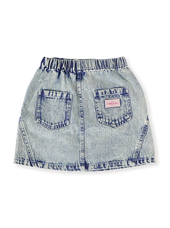 The Goldie + Ace Esta A-Line Denim Skirt in Light Denim pictured on a transparent background. The material is 100% cotton. It is a bottom made for babies, toddlers and kids.