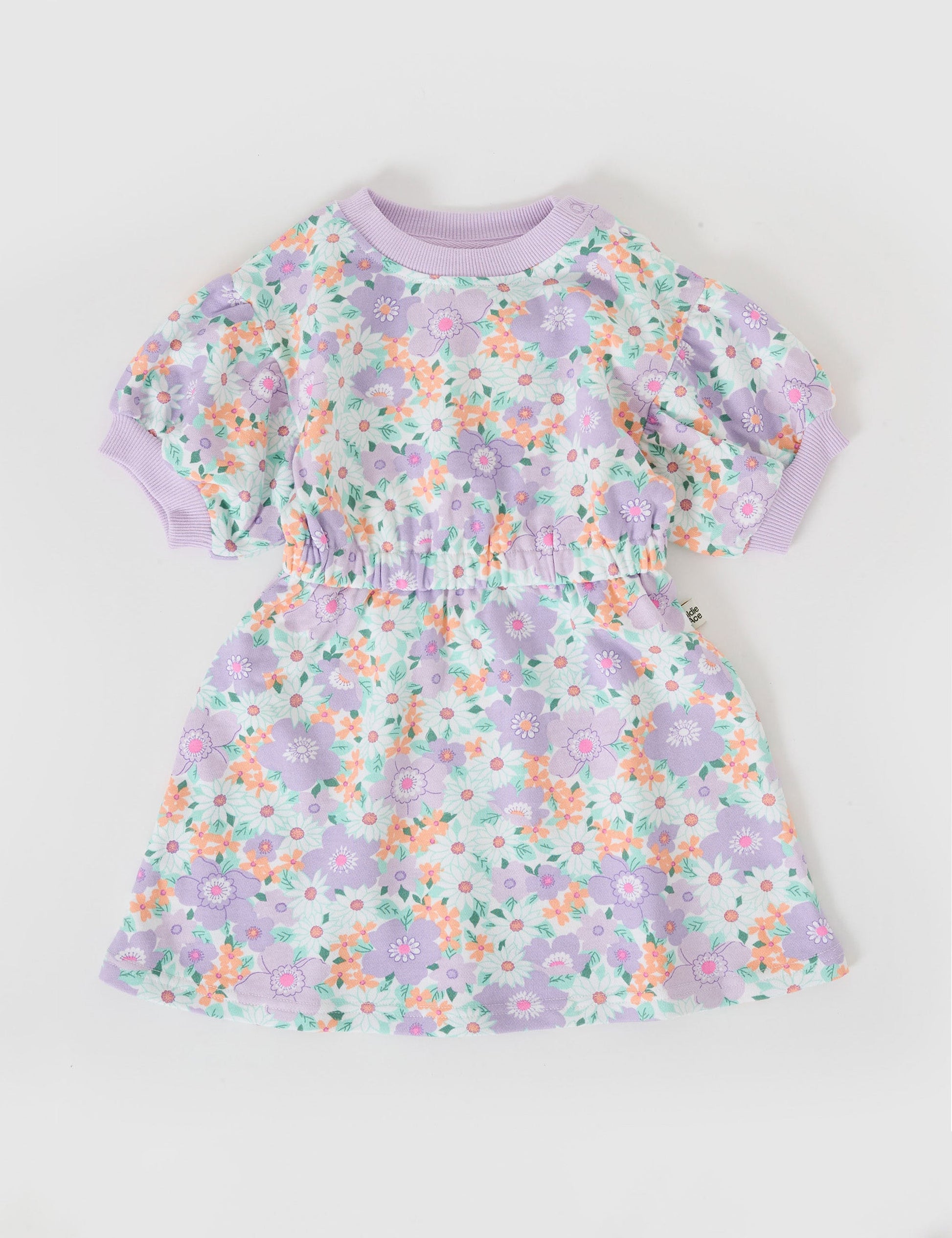 The Goldie + Ace Flora Molly Short Sleeve Dress in Lilac Multi pictured on a grey background. The material is cotton terry. It is a dress made for babies, toddlers and kids.