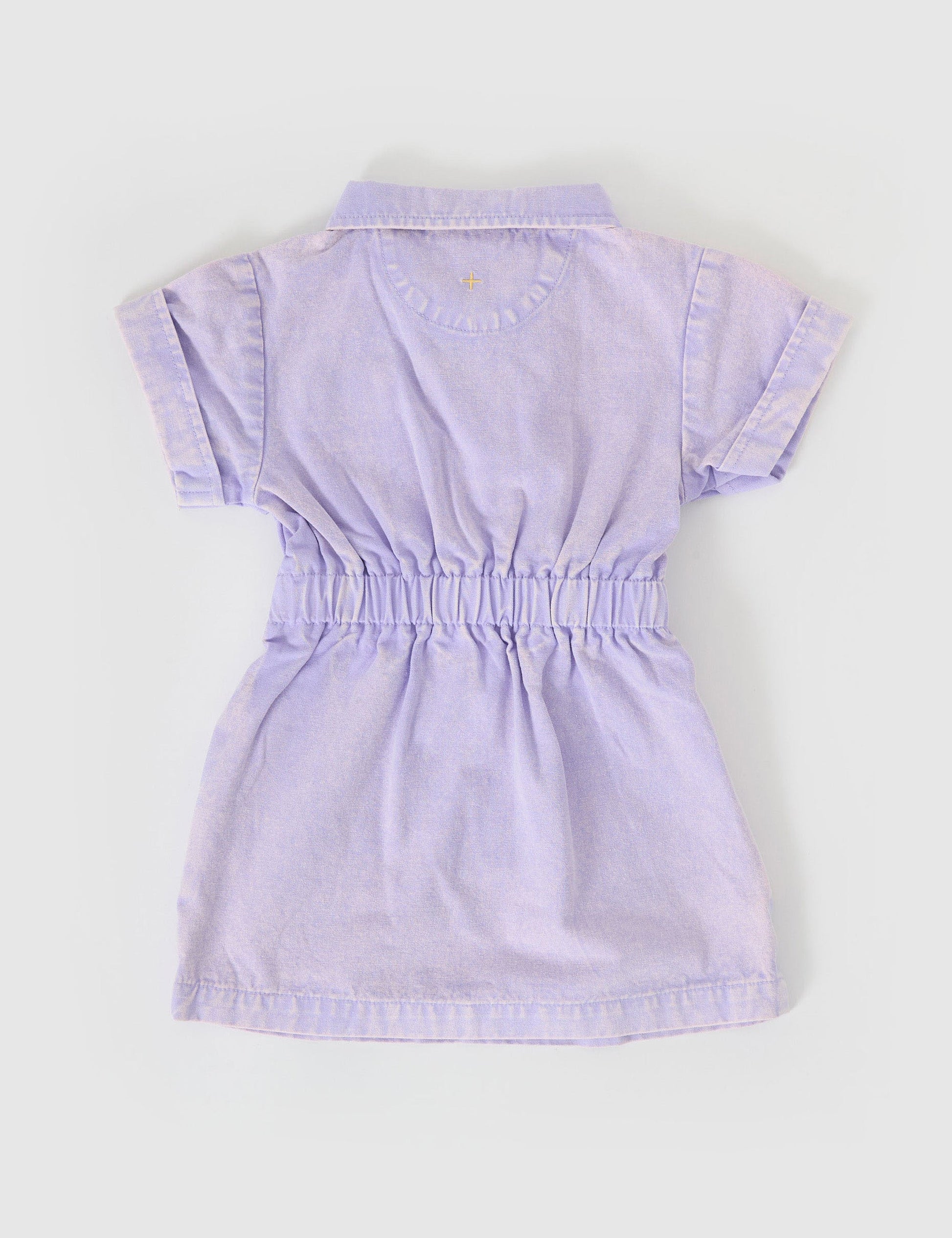 The Goldie + Ace Piper Denim Belted Dress in Mauve pictured on a grey background. The material is cotton twill. It is a dress made for babies, toddlers and kids.