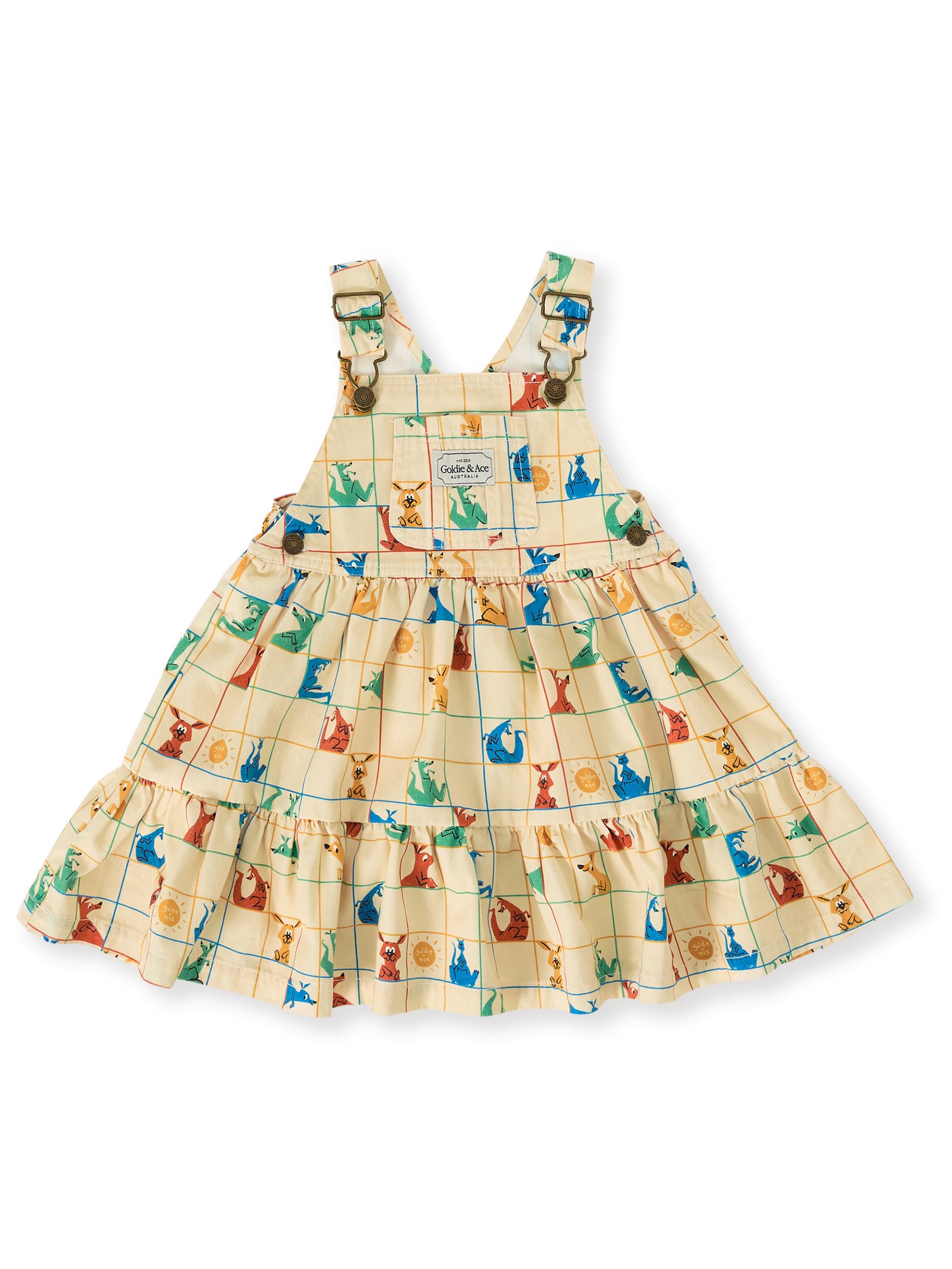 The Goldie + Ace Hopscotch Tully Tiered Pinafore Dress in Vanilla/Primary pictured on a transparent background. The material is 100% cotton. It is a dress made for babies, toddlers and kids.
