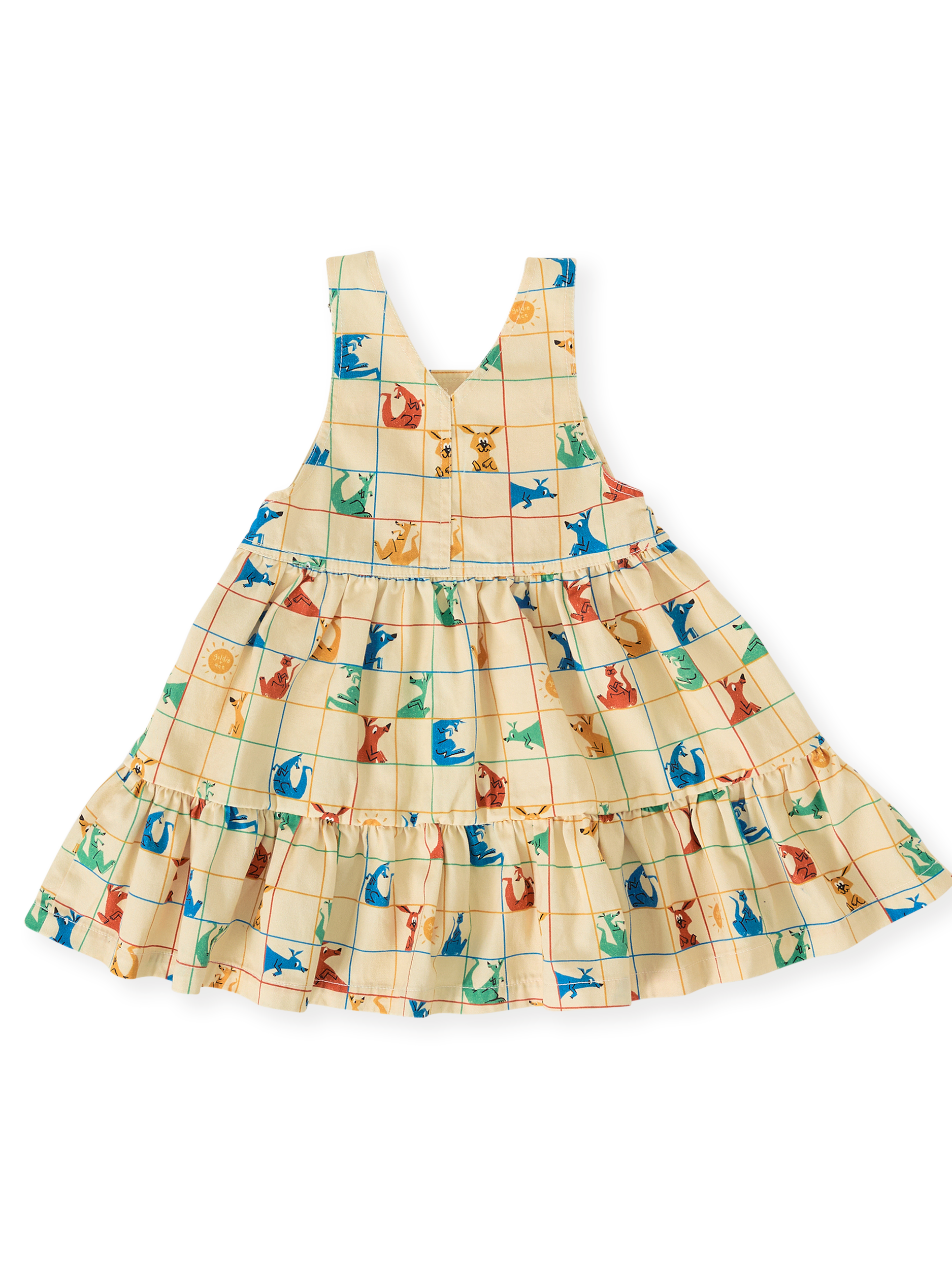 The Goldie + Ace Hopscotch Tully Tiered Pinafore Dress in Vanilla/Primary pictured on a transparent background. The material is 100% cotton. It is a dress made for babies, toddlers and kids.