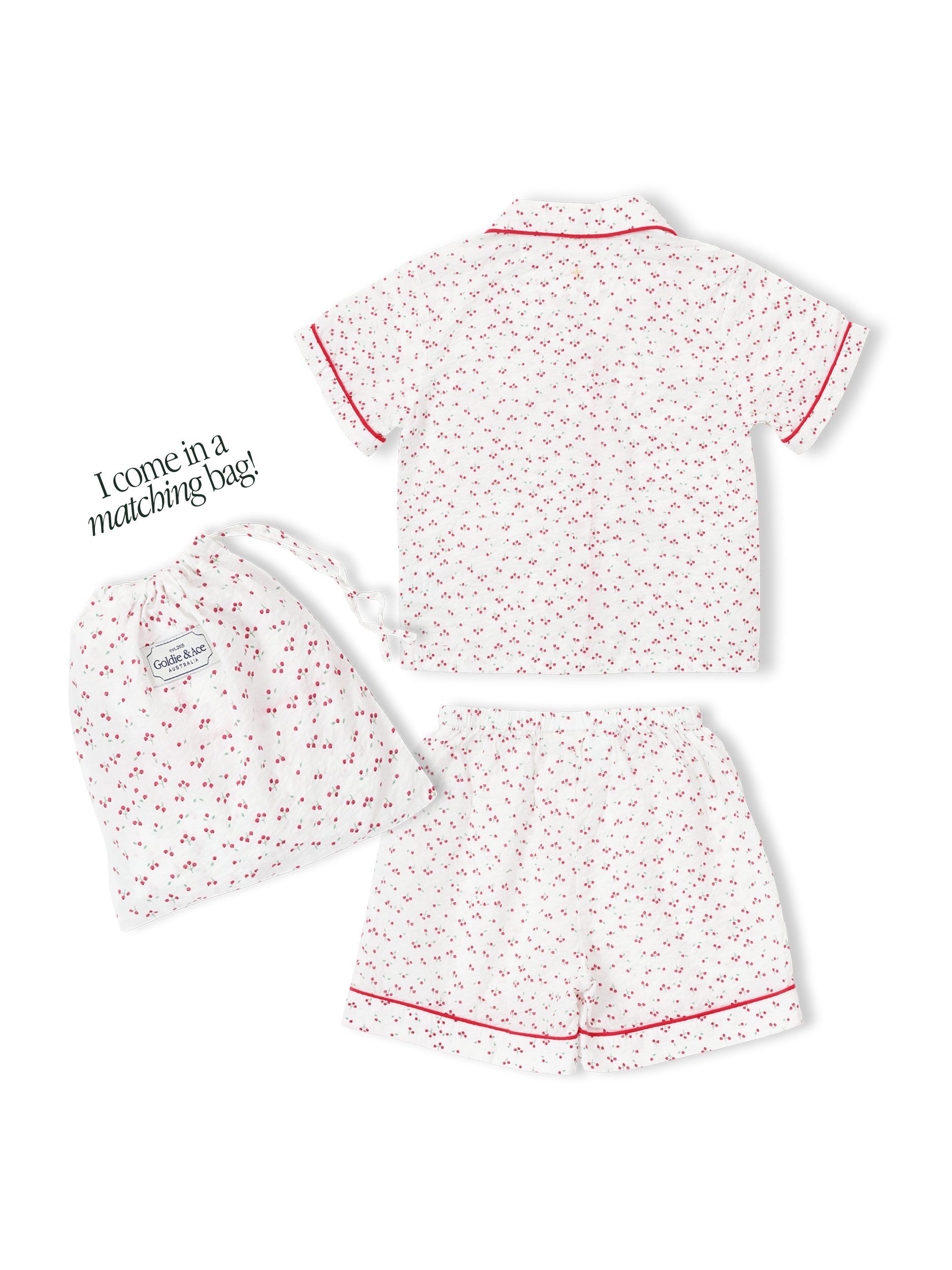 Children's pyjama set with cherry print on seersucker cotton, and a matching drawstring bag