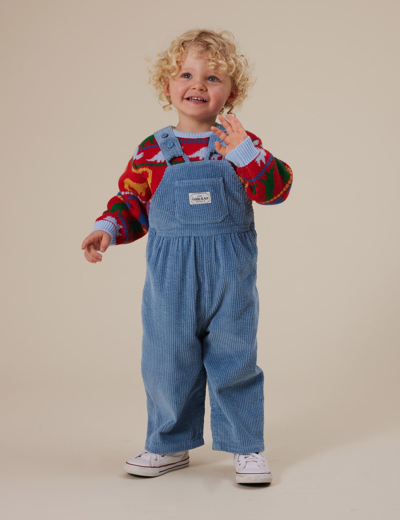 The Goldie + Ace Sammy Corduroy Overalls in Duck Egg pictured on a grey background. The material is cotton cord. It is a overall made for babies, toddlers and kids.