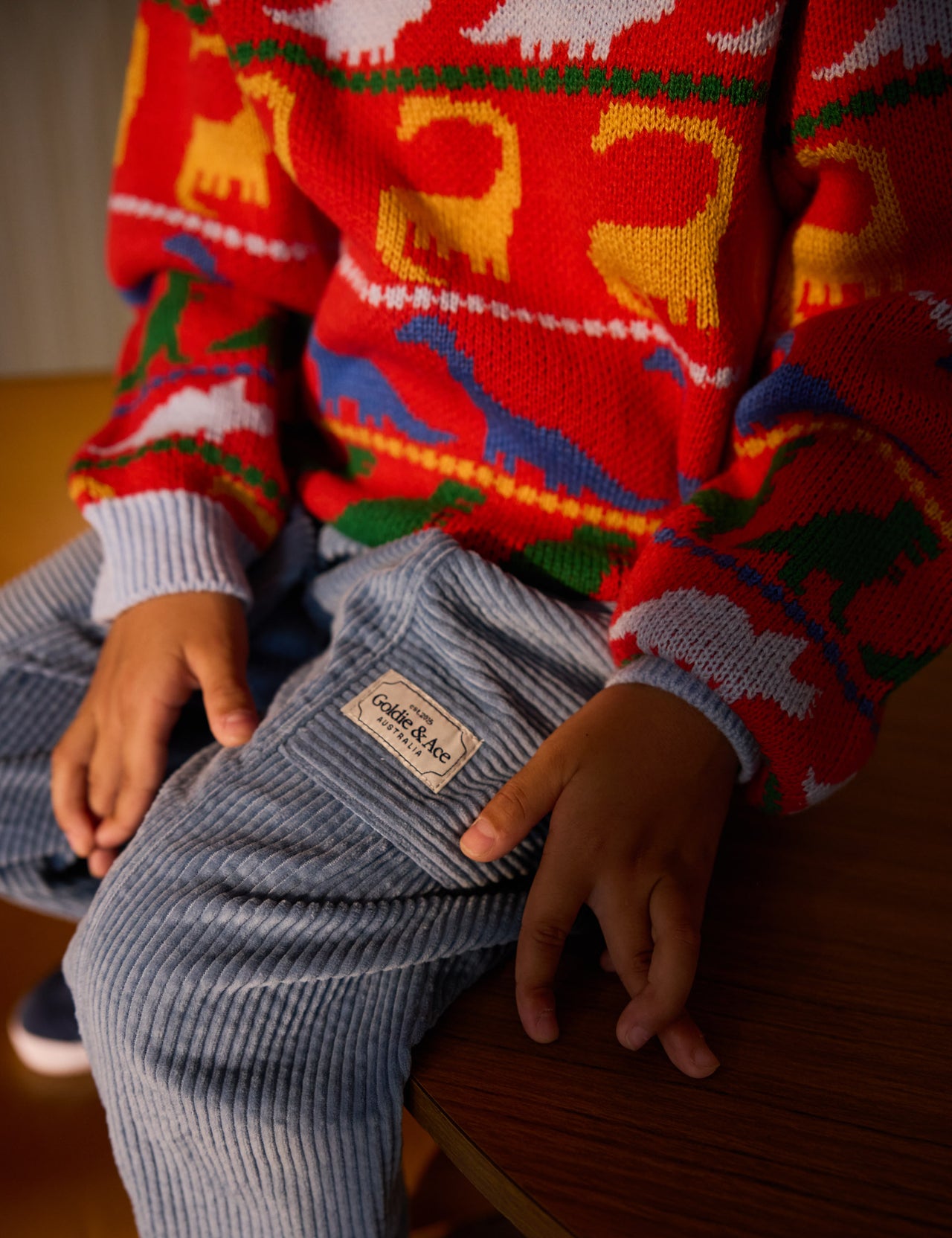 The Goldie + Ace Kit Corduroy Pocket Pant in Duck Egg pictured on a grey background. The material is cotton cord. It is a bottom made for babies, toddlers and kids.