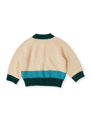 The Goldie + Ace Marley Koala Knit Jumper in Vanilla/Teal pictured on a transparent background. The material is soft acrylic blend with wool and nylon. It is a top made for babies, toddlers and kids.