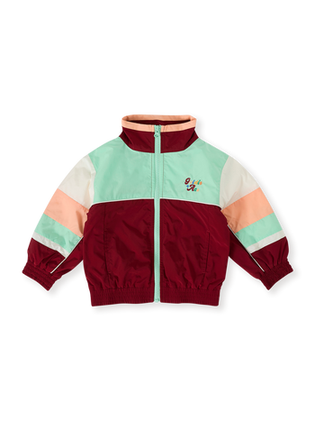 The Goldie + Ace Fun Run Retro Spray Jacket in Brick/Peapod pictured on a transparent background. The material is poly with cotton lining. It is a jacket made for babies, toddlers and kids.