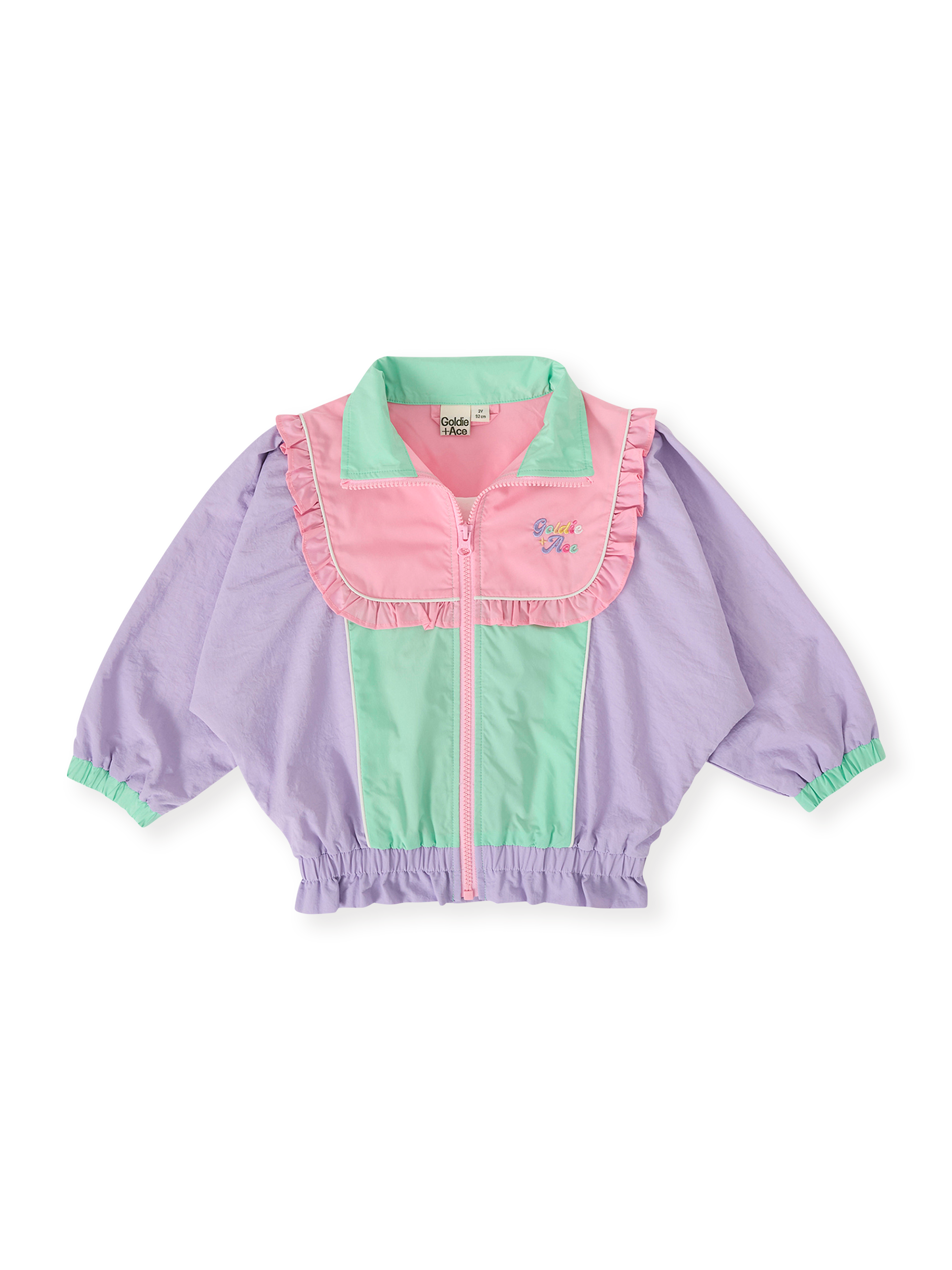 The Goldie + Ace Frill Seekers Retro Spray Jacket in Lilac/Rose/Peapod pictured on a transparent background. The material is poly with cotton lining. It is a jacket made for babies, toddlers and kids.