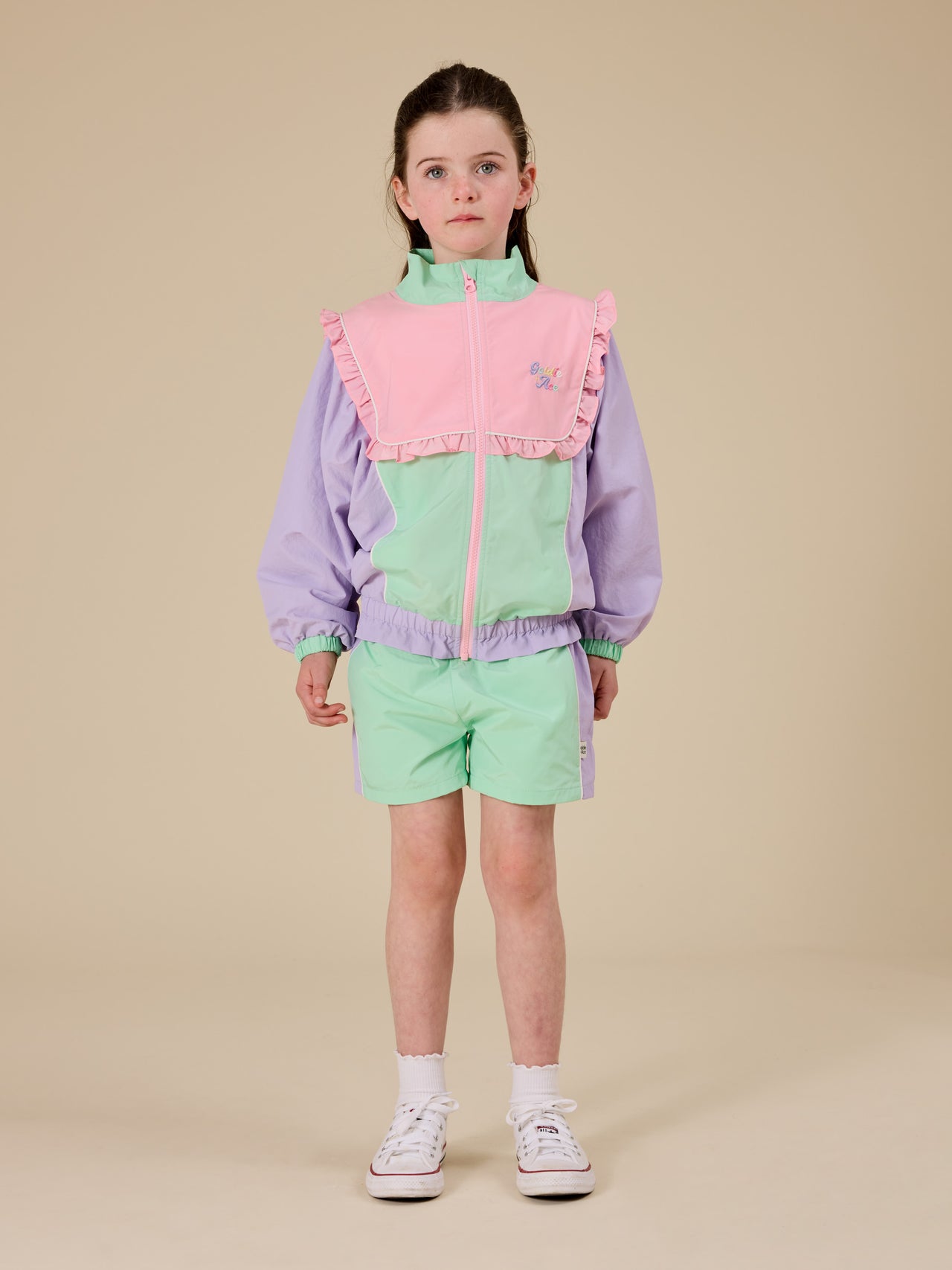 The Goldie + Ace Retro Sporty Shorts in Peapod/Lilac pictured on a transparent background. The material is poly with cotton lining. It is a bottom made for babies, toddlers and kids.