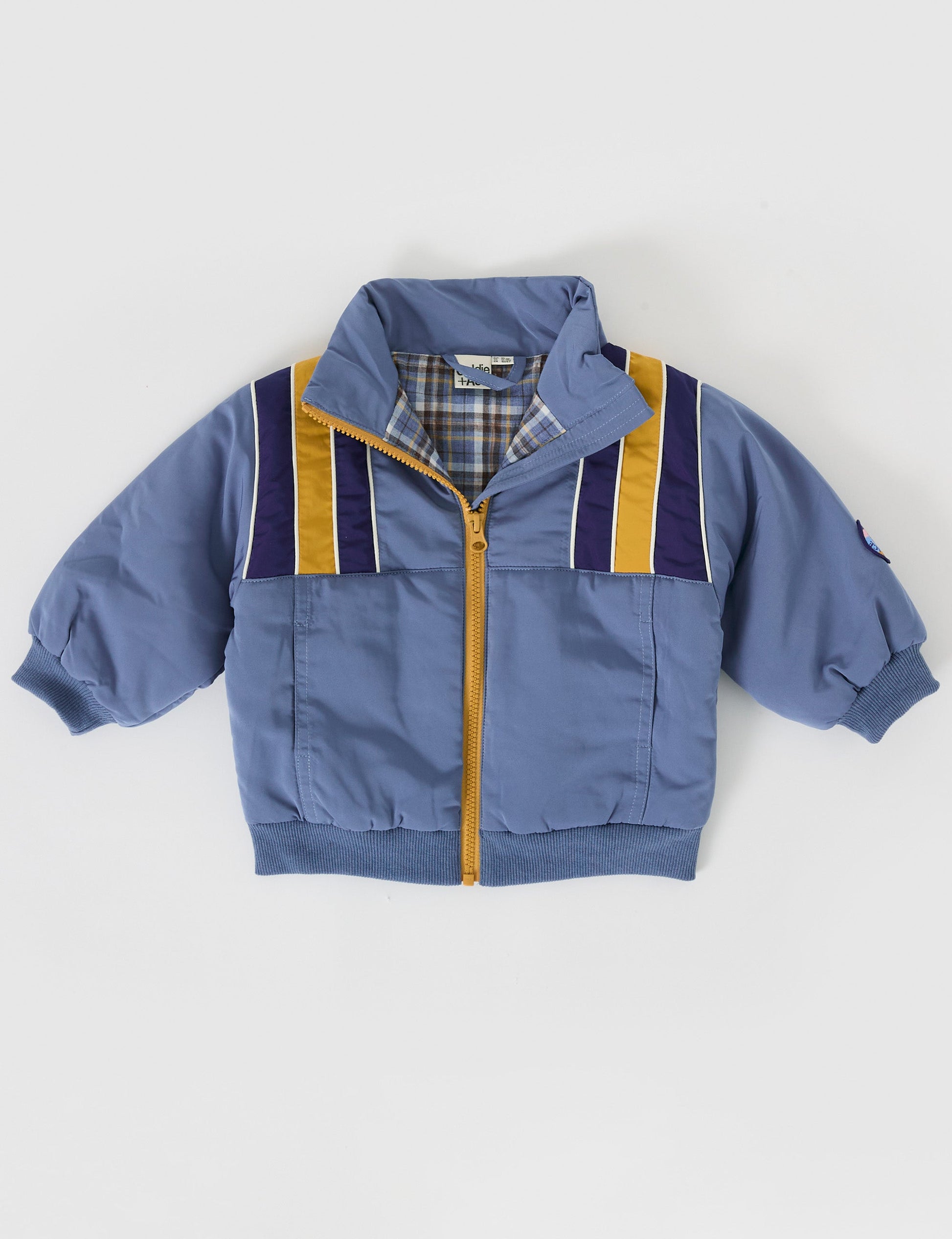 The Goldie + Ace Jordan Jacket in Duck Egg/Golden pictured on a grey background. The material is poly with poly lining. It is a jacket made for babies, toddlers and kids.