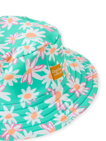 The Goldie + Ace Daisy Patch Swim Bucket Hat in Moss pictured on a transparent background. The material is . It is a swimwear made for babies, toddlers and kids.