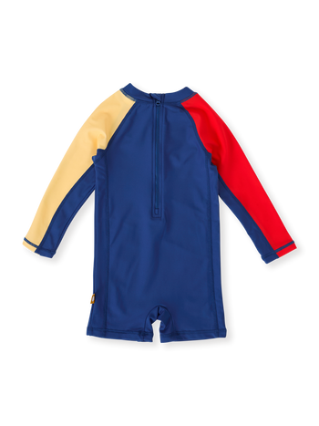 The Goldie + Ace Nautical Flag Short Leg Swimsuit in Blue/Yellow/Red pictured on a transparent background. The material is . It is a swimwear made for babies, toddlers and kids.