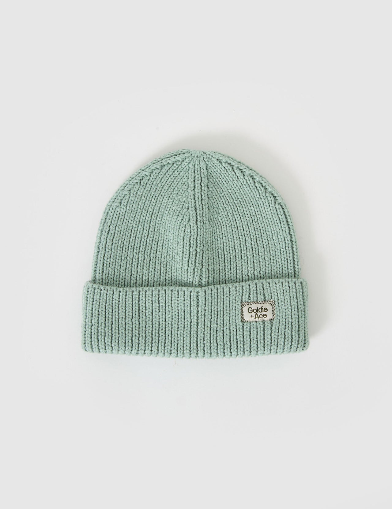 The Goldie + Ace Wool Beanie Mint in Mint pictured on a grey background. The material is 100% merino wool. It is a accessory made for babies, toddlers and kids.