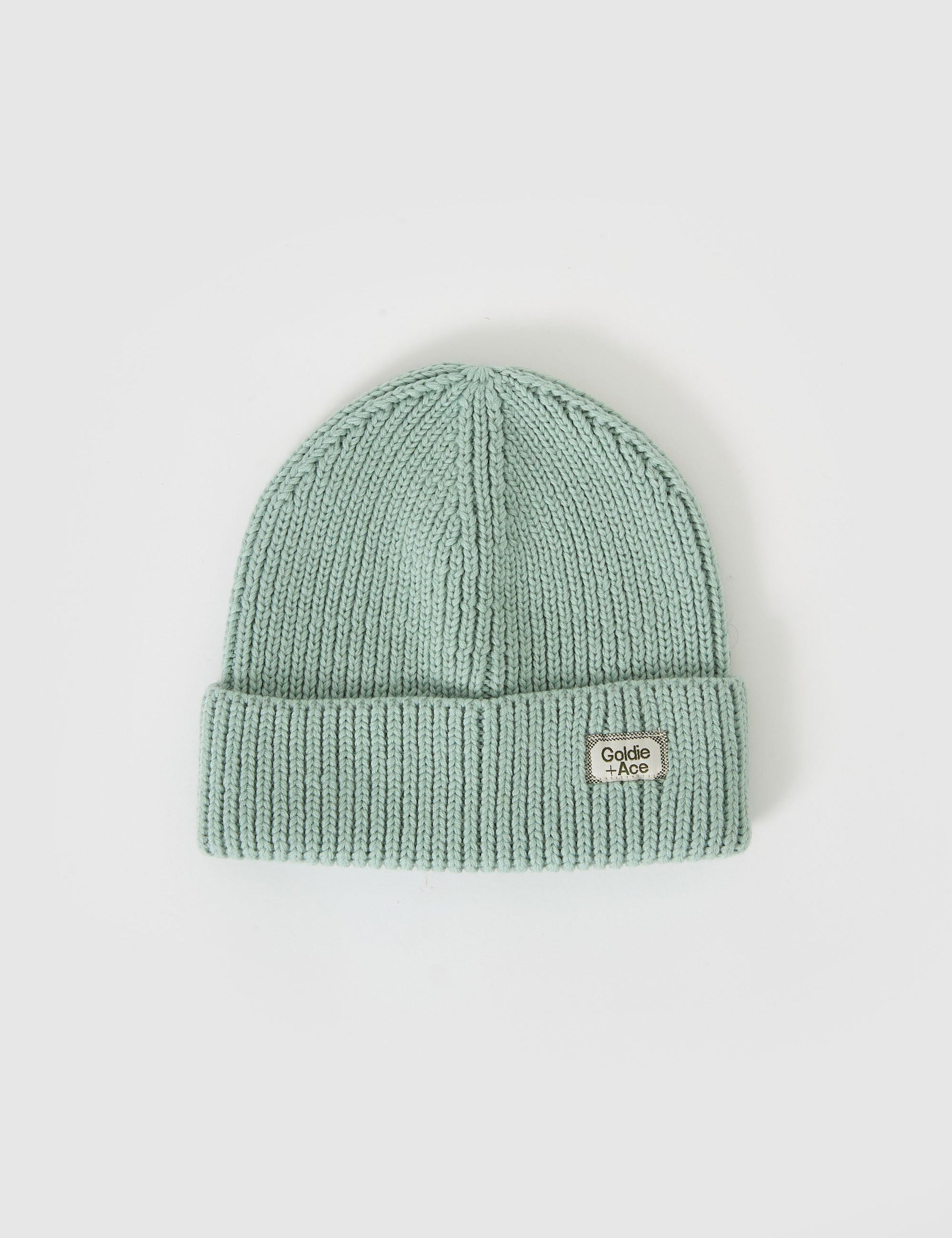 The Goldie + Ace Wool Beanie Mint in Mint pictured on a grey background. The material is 100% merino wool. It is a accessory made for babies, toddlers and kids.