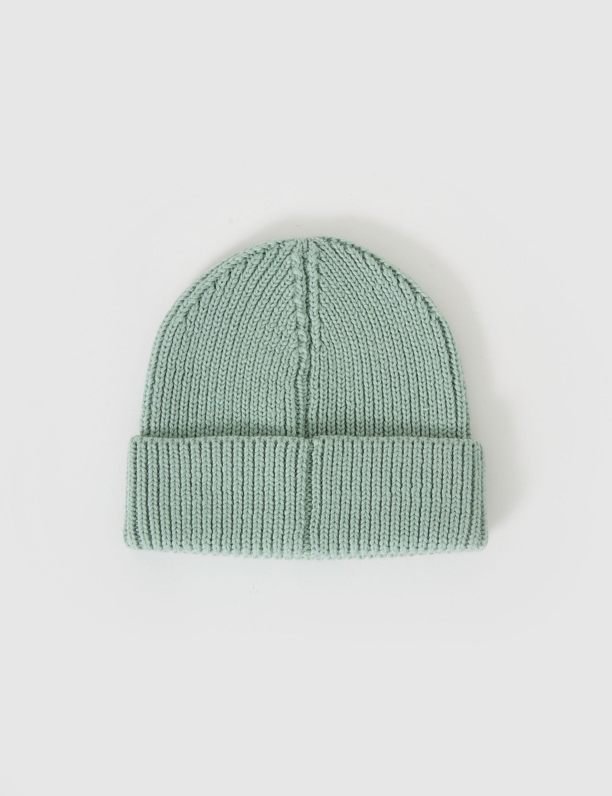 The Goldie + Ace Wool Beanie Mint in Mint pictured on a grey background. The material is 100% merino wool. It is a accessory made for babies, toddlers and kids.