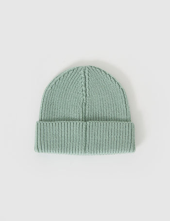 The Goldie + Ace Wool Beanie Mint in Mint pictured on a grey background. The material is 100% merino wool. It is a accessory made for babies, toddlers and kids.