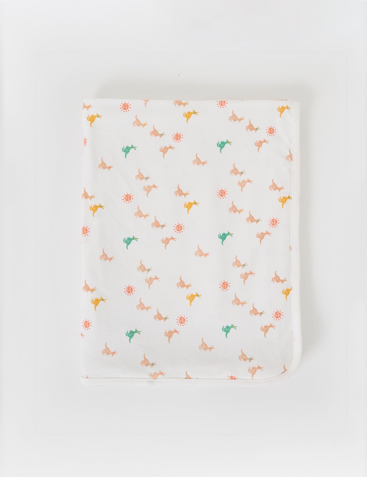 The Goldie + Ace Joey Baby Wrap in Vanilla pictured on a grey background. The material is soft cotton elastane. It is a babywear made for babies, toddlers and kids.