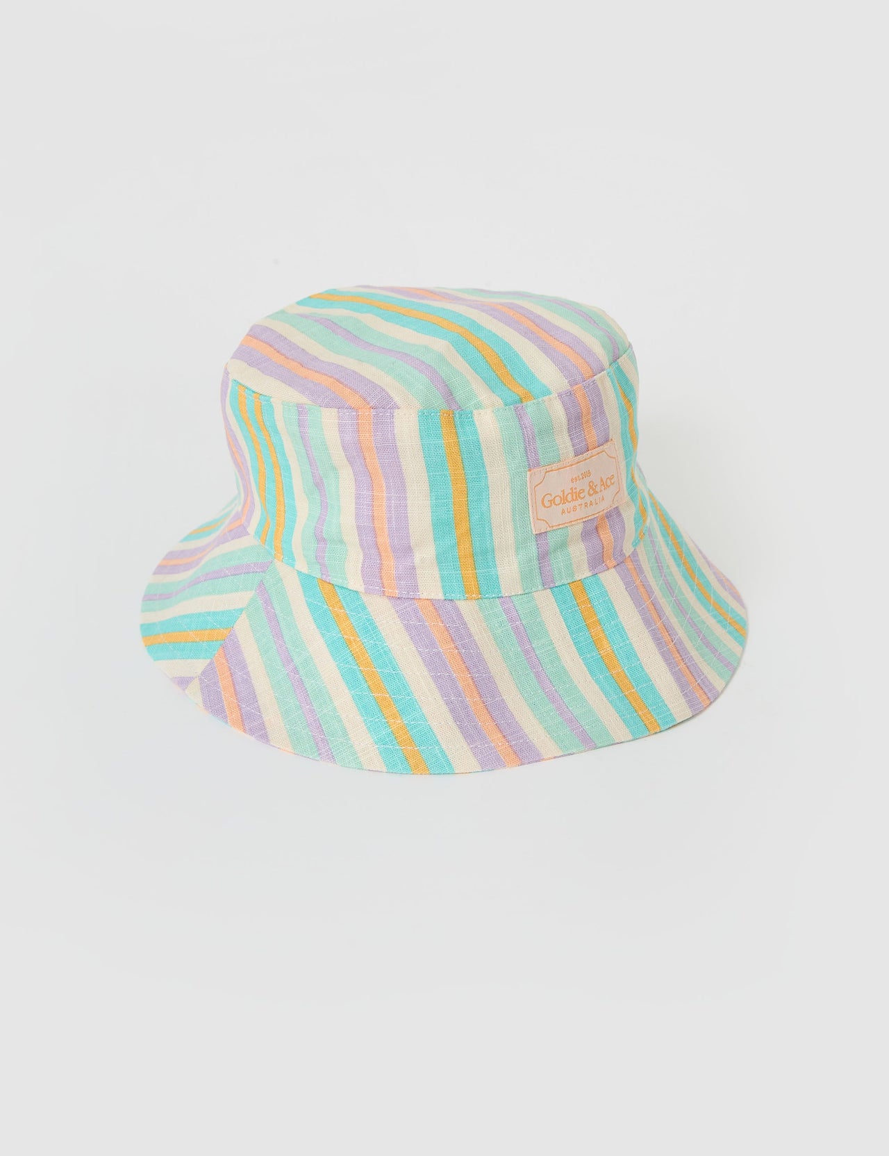 The Goldie + Ace Linen Bucket Hat in Resort Stripe pictured on a grey background. The material is linen. It is a accessory made for babies, toddlers and kids.