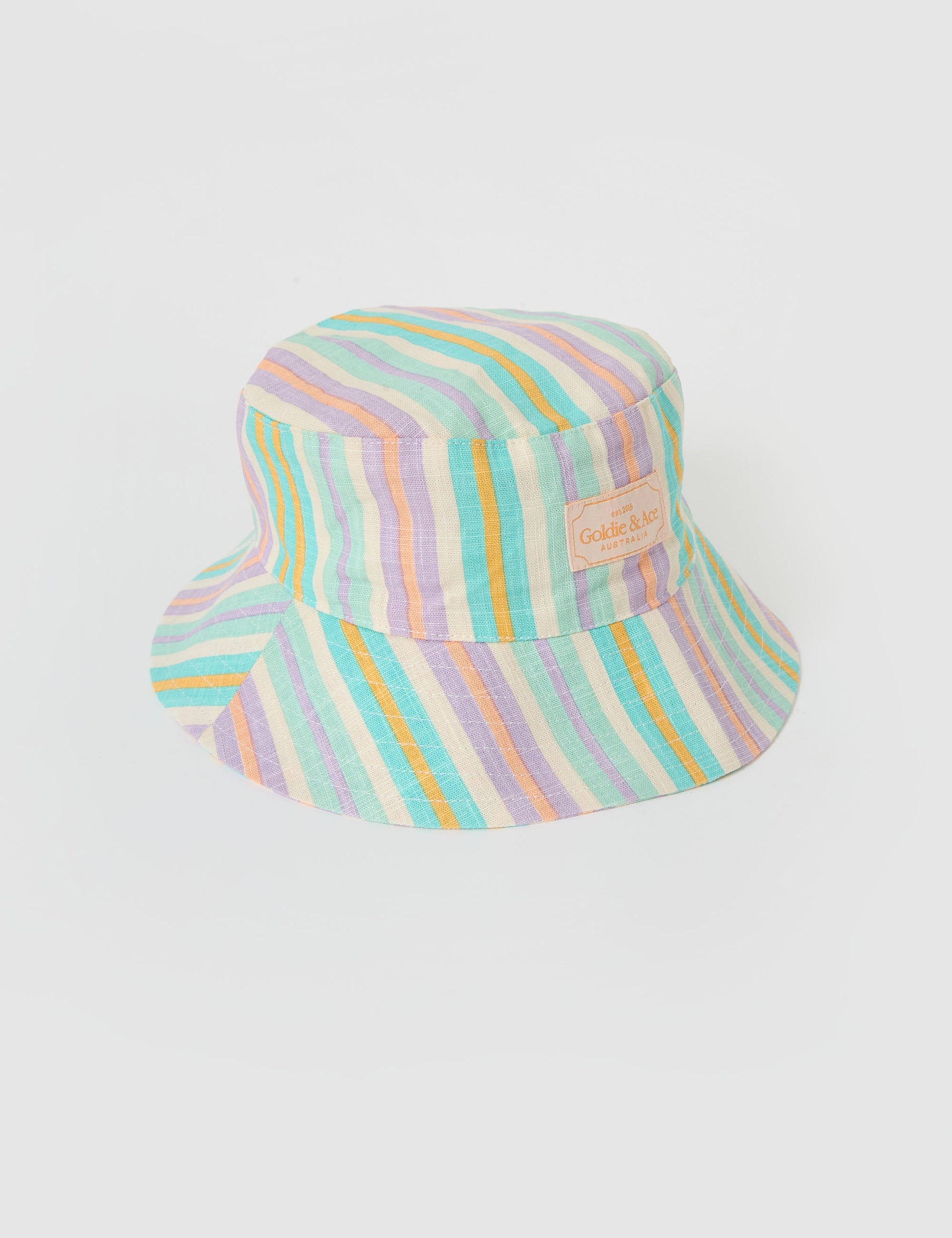 The Goldie + Ace Linen Bucket Hat in Resort Stripe pictured on a grey background. The material is linen. It is a accessory made for babies, toddlers and kids.